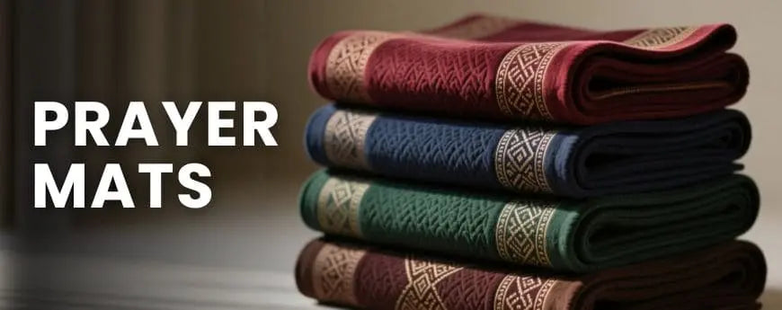 Stack of prayer mats with text 'PRAYER MATS' on a dark background